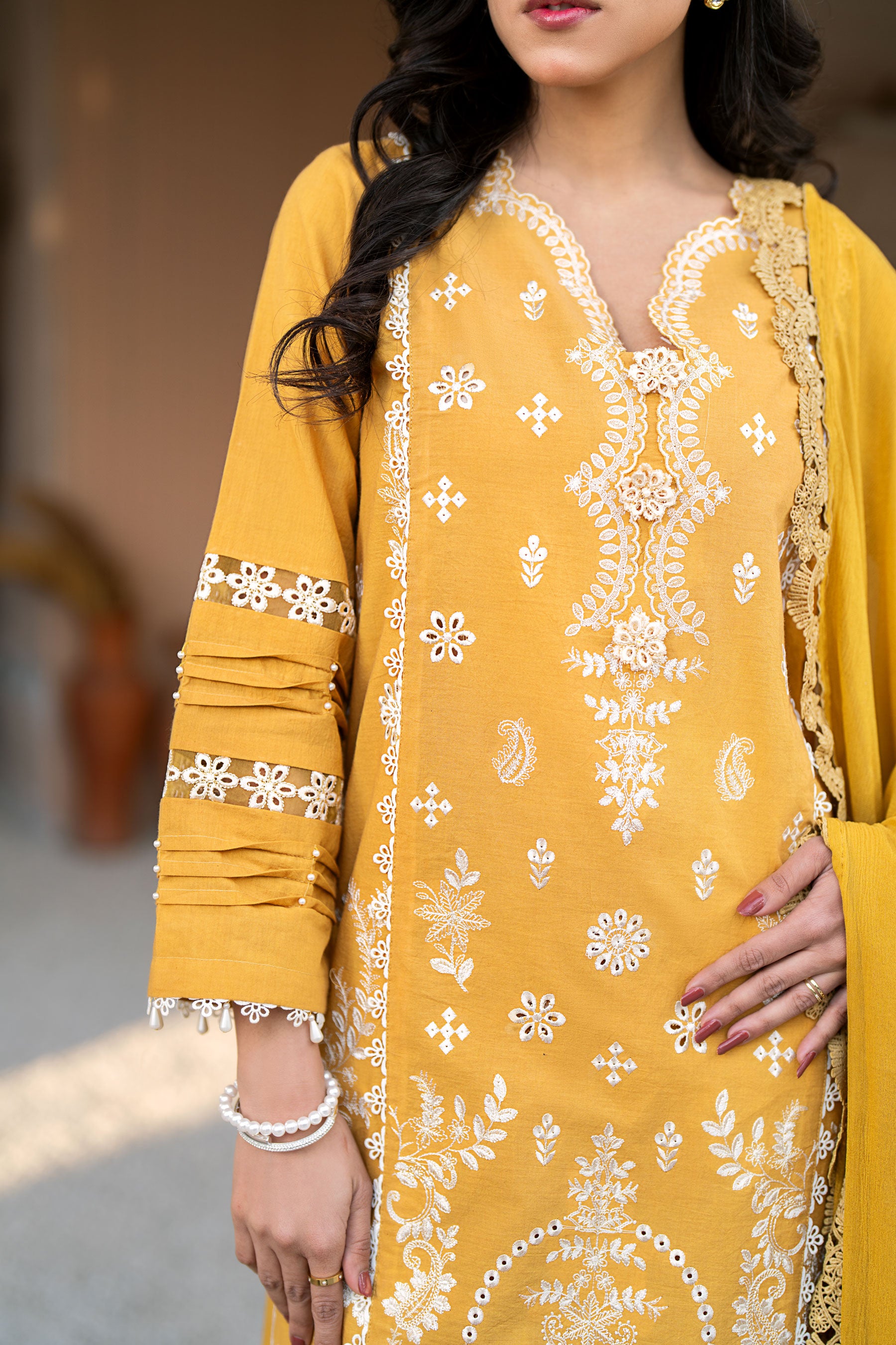 Marigold 3 Piece Embroidered Lawn Stitched Suit.Order now